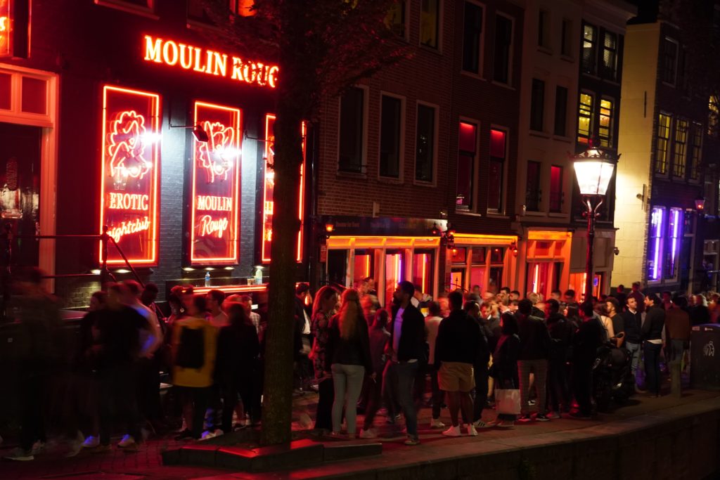 A picture of people outside Amsterdam's Moulin Rouge