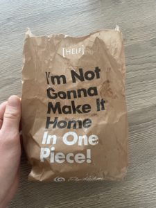 Photo of a brown paper bag containing fudge that reads "I'm Not Gonna Make It Home In One Piece!"