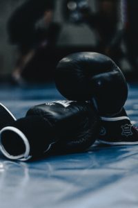 Boxing gloves on the floor of a boxing ring