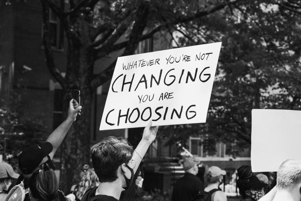 Man holding up sign at protest