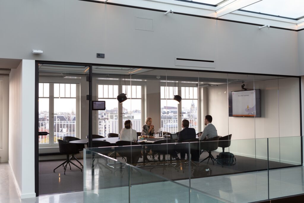 People sat in meeting boardroom