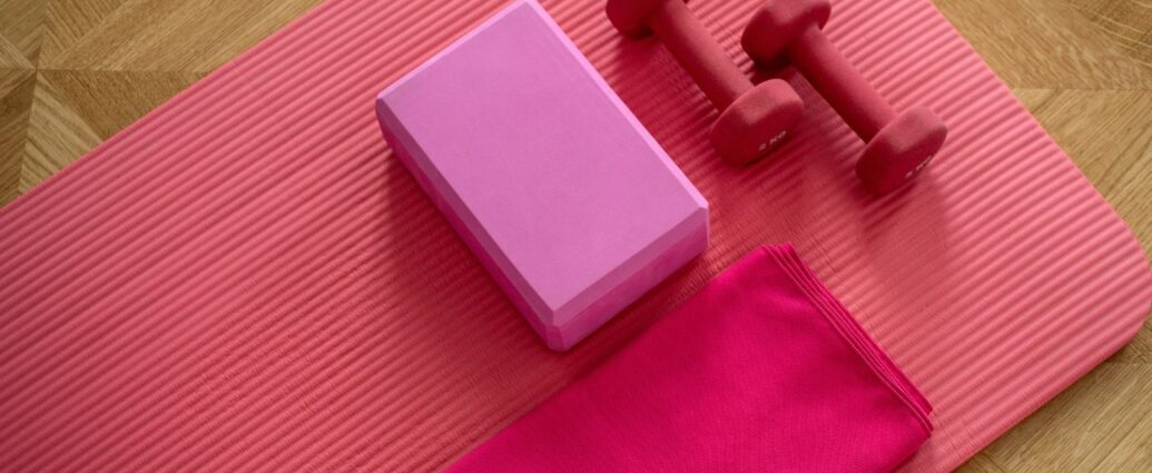 Pink exercise mat and weights.