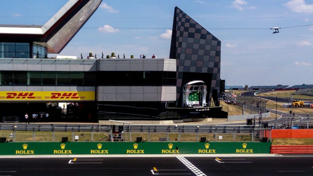 The pitlane entrance, starting grid and podium at Silverstone motor racing circuit during the British Grand Prix. Since this year's Silverstone, it has been announced that Daniel Ricciardo has returned to the full line up!