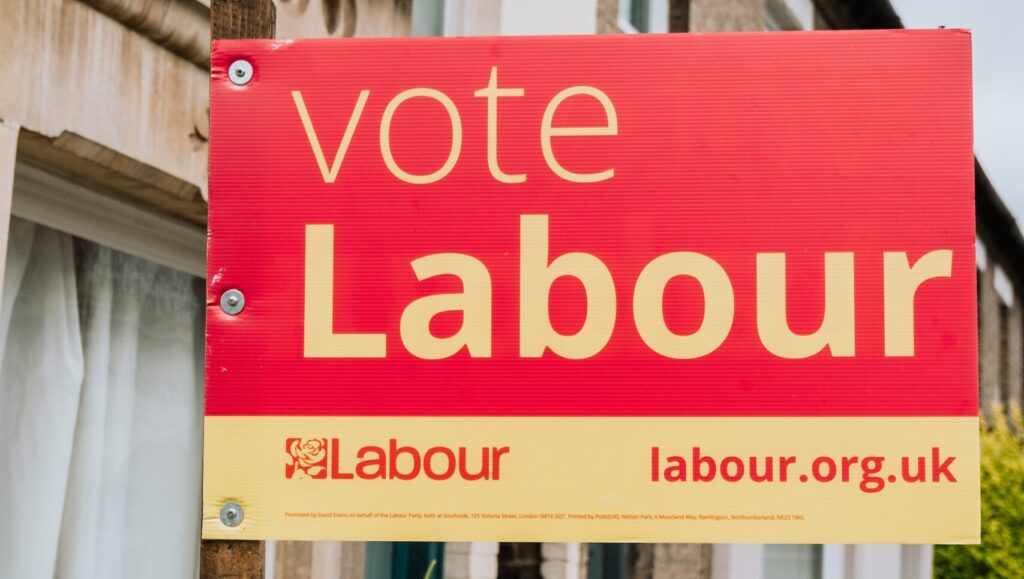 A political banner displaying 'vote Labour'.