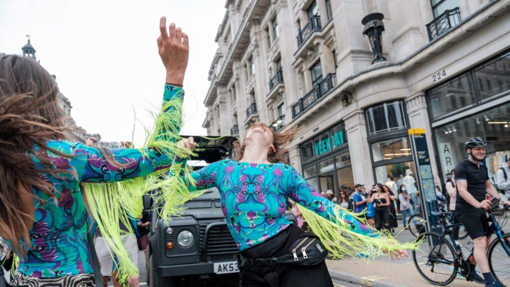 Two women partying on the street