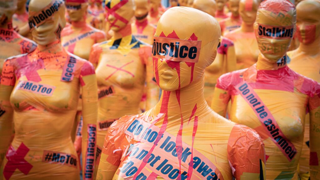 Image shows mannequins covered with slogans against sexual violence [perfect victim myth]