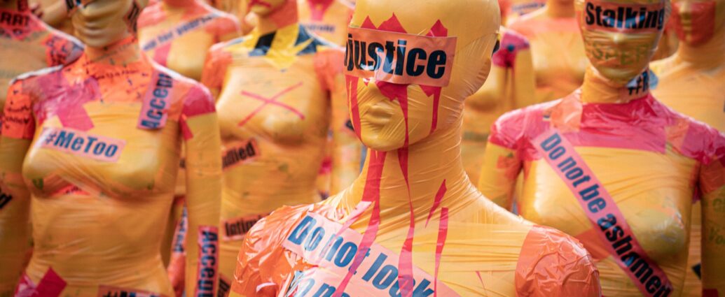 Image shows mannequins covered with slogans against sexual violence [perfect victim myth]