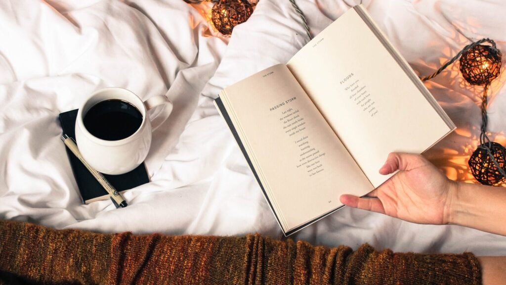 woman reading in her bed