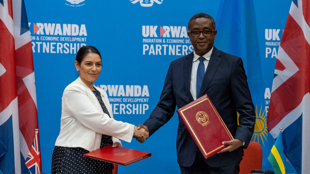 Ex-Home Secretary Priti Patel and Minister Biruta sign the migration and economic development partnership between the UK and Rwanda.