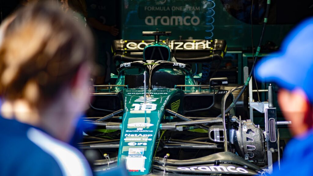 green and black Formula 1 car. Formula 1's sustainability strategy.