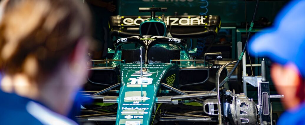 green and black Formula 1 car. Formula 1's sustainability strategy.