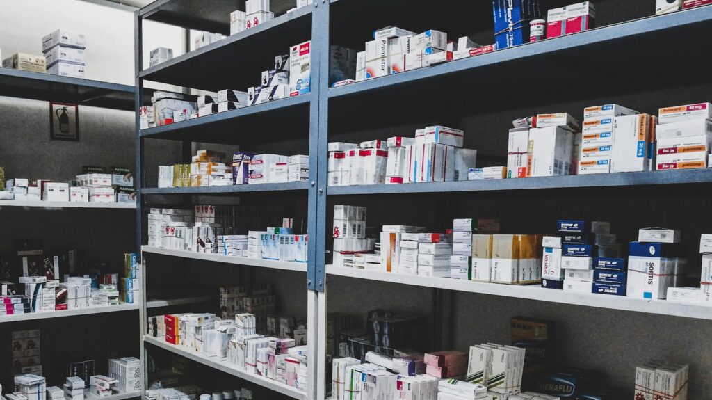 Image of medicines on shelves in a NHS pharmacy under new scheme.