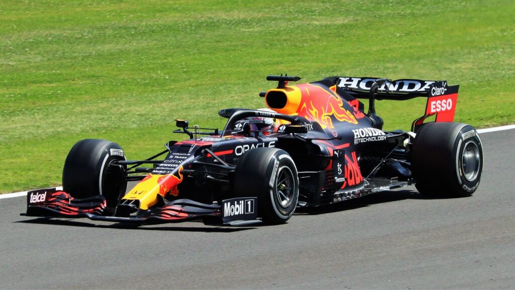 black, red and yellow formula one car on the Bahrain Grand Prix 2024 track