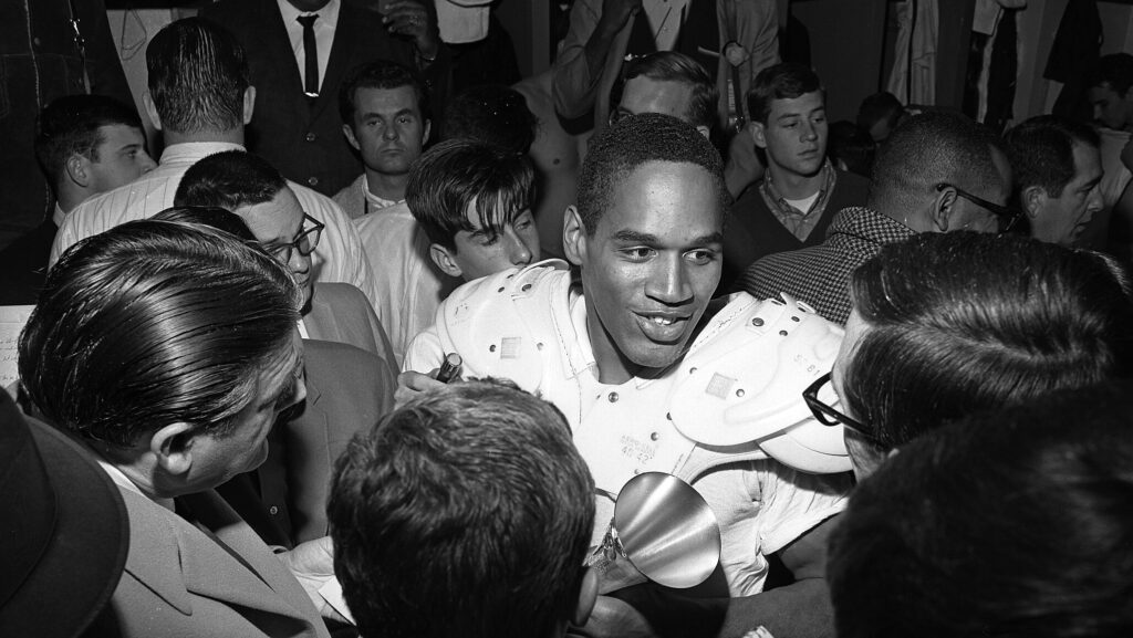 O.J. Simpson is interviewed by the press after leading Trojans to 14-3 Rose Bowl win. Simpson, who gained 128 yards in 25 carries, was named Player of the Game.