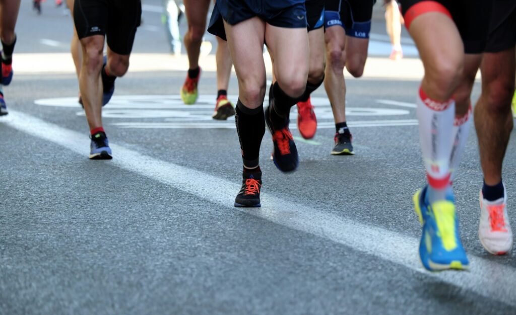 People running on road at Manchester Marathon