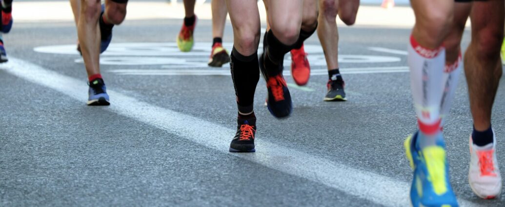 People running on road at Manchester Marathon