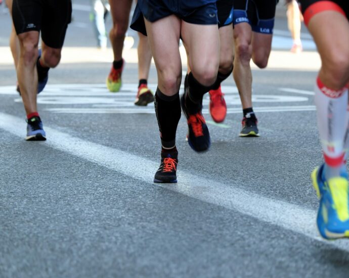 People running on road at Manchester Marathon