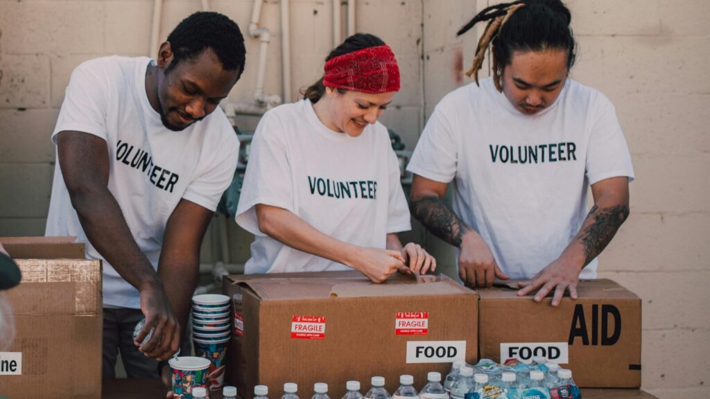 Image shows a group of people volunteering