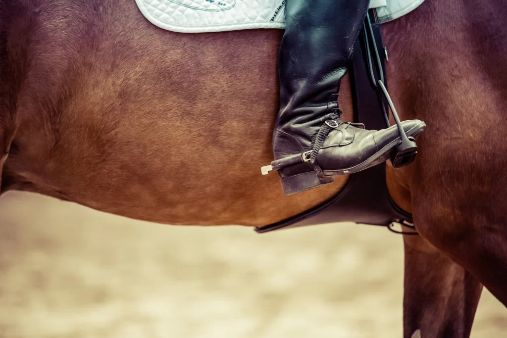 horse rider's boot in the stirrup