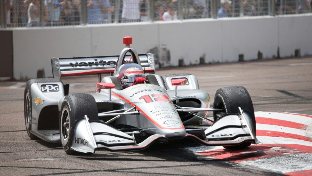 Formula one cars on race track. IndyCar