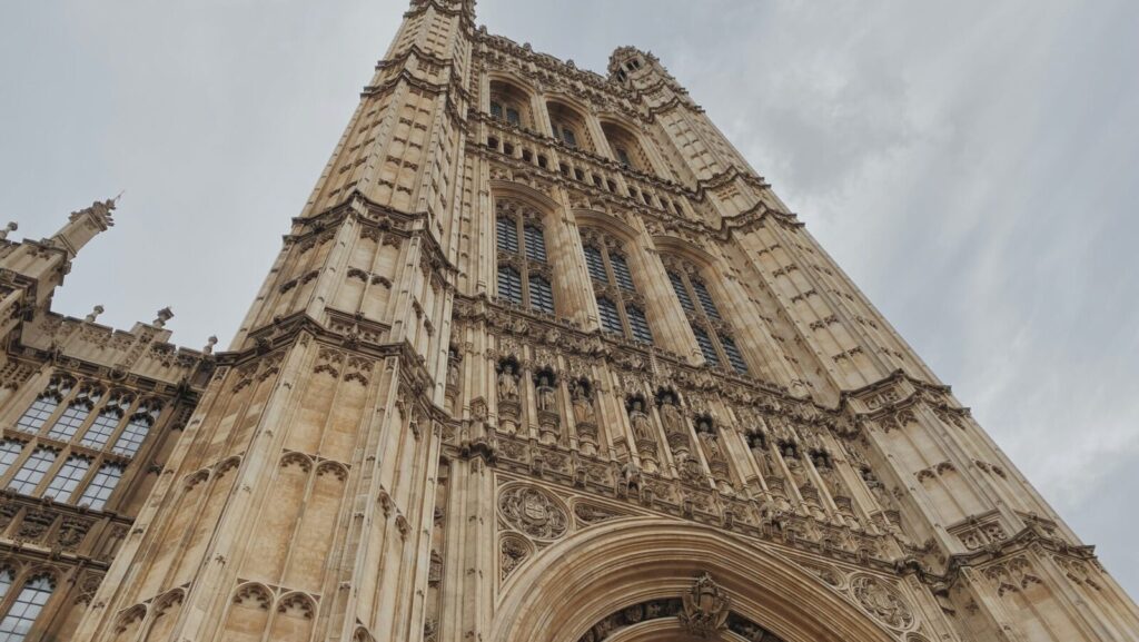 The Palace of Westminster against a cloudy sky. With the UK electing its first atheist Prime Minister, is it time we reassessed the relationship between politics and religion in Westminster?