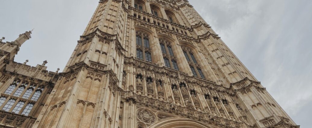 The Palace of Westminster against a cloudy sky. With the UK electing its first atheist Prime Minister, is it time we reassessed the relationship between politics and religion in Westminster?