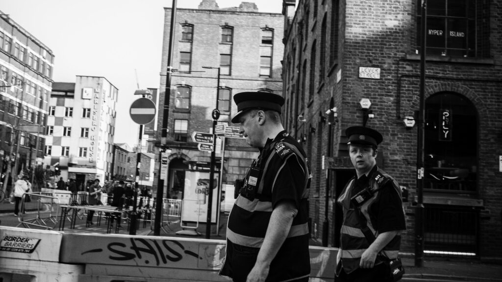 Black and white image of Manchester Police. Far-right violence