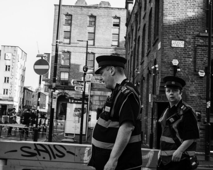 Black and white image of Manchester Police. Far-right violence