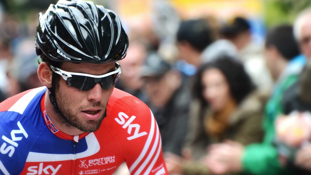 Mark Cavandish in lycra and helmet cycling