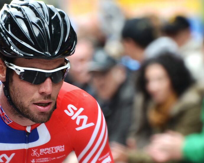 Mark Cavandish in lycra and helmet cycling