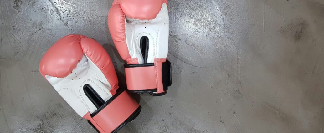 A pair of pink boxing gloves. The Paris Olympics boxing has shown that transphobia and misinformation are alive and well