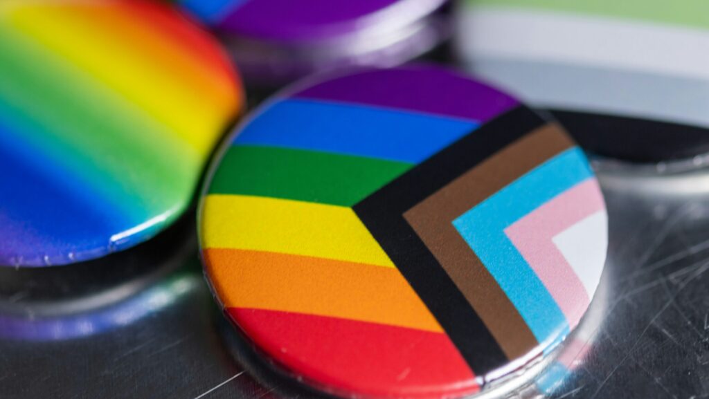 colourful LGBT flag on badge