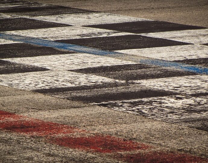 black and white cheques painted on floor. Motorsport Olympics