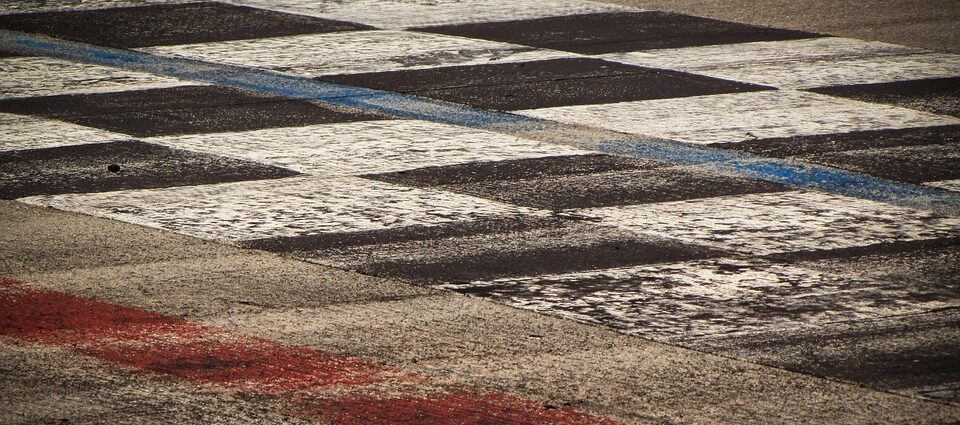 black and white cheques painted on floor. Motorsport Olympics