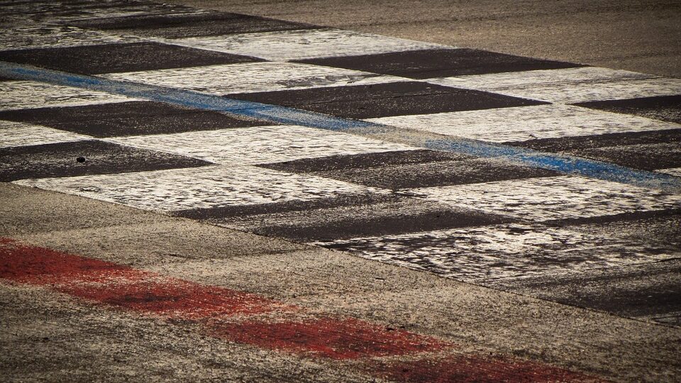 black and white cheques painted on floor. Motorsport Olympics