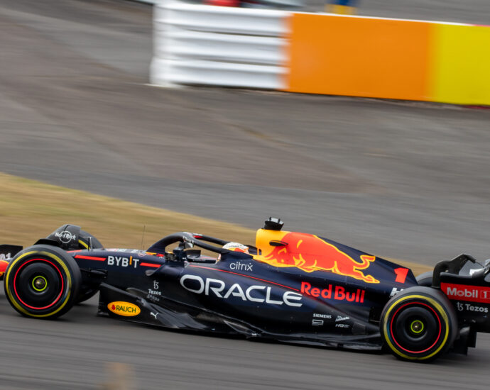 A black and red racing car on racing track