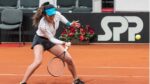 female tennis player on a tennis court. Emma Raducanu US open.