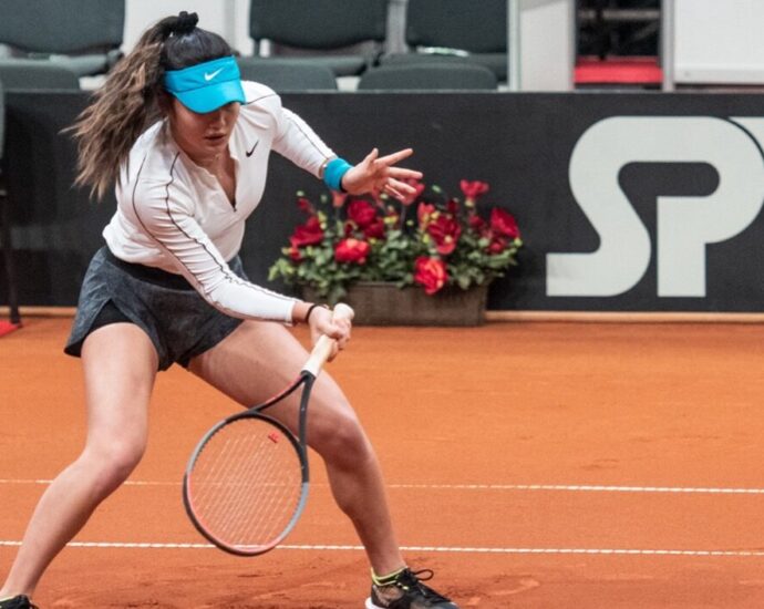 female tennis player on a tennis court. Emma Raducanu US open.