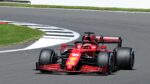 Charles Leclerc's red racing car with black wheels on racing track at Italian Grand Prix.