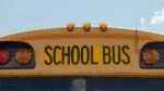 Featured image of a yellow school bus with school bus in black writing.