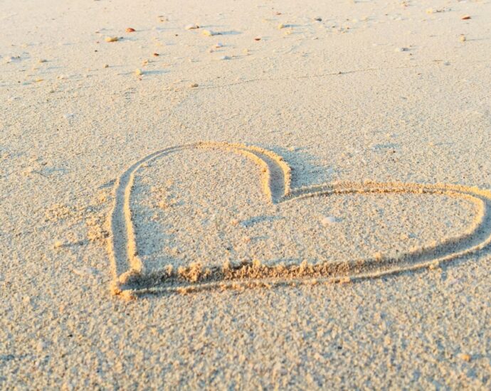 heart drawn in the sand