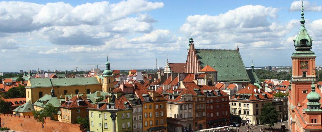 An image of Warsaw, where A Real Pain takes place, showing bright buildings and blue skies