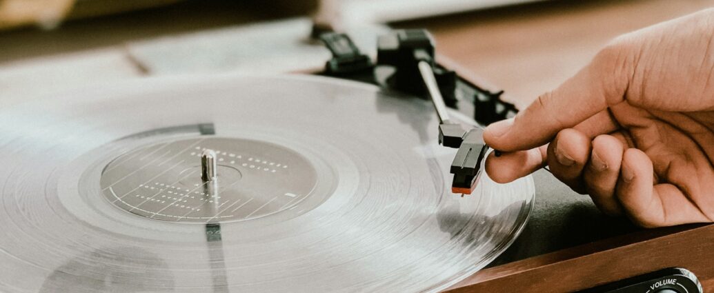 Vinyl record playing on record player in a house.