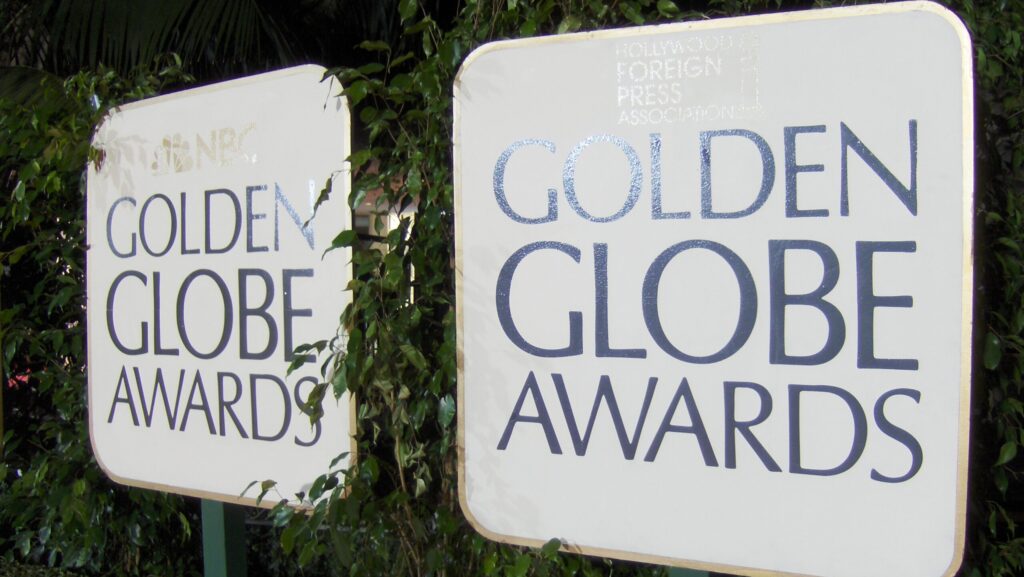 Two white signs with the words Golden Globe Awards on them.