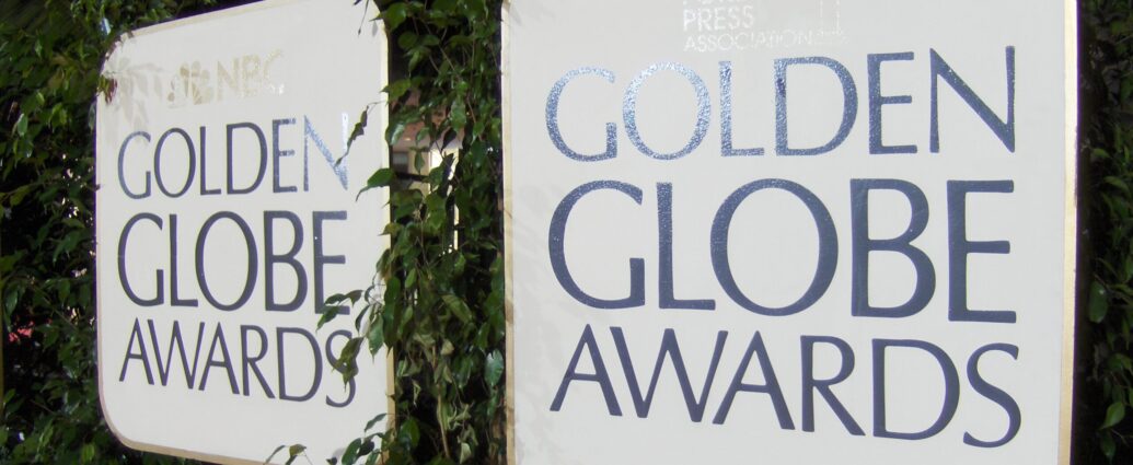 Two white signs with the words Golden Globe Awards on them.