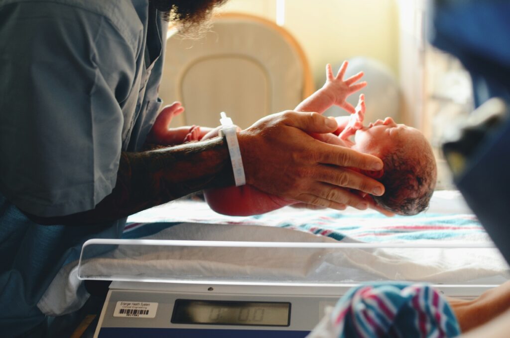 Image of newborn baby in hospital to represent the abortion law